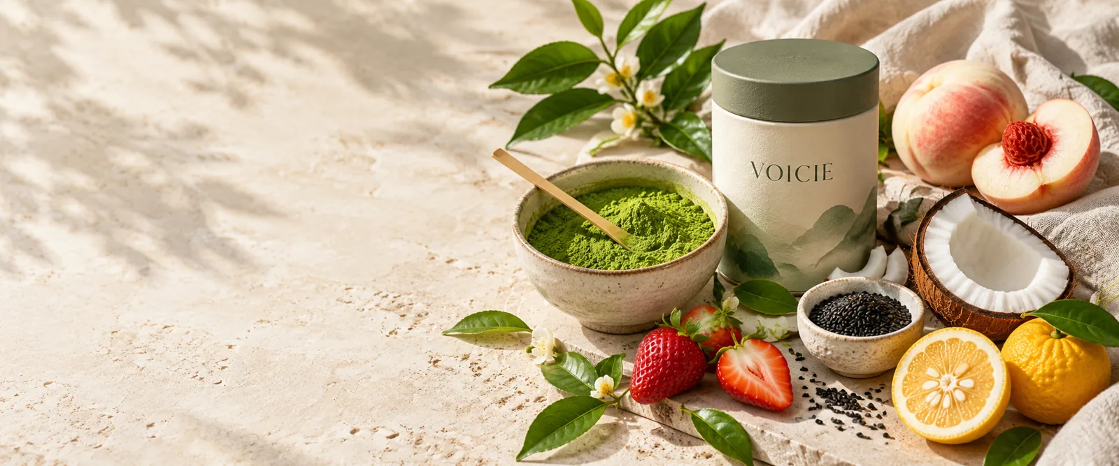 Matcha, fruit, sesame and coconut arranged on warm stone